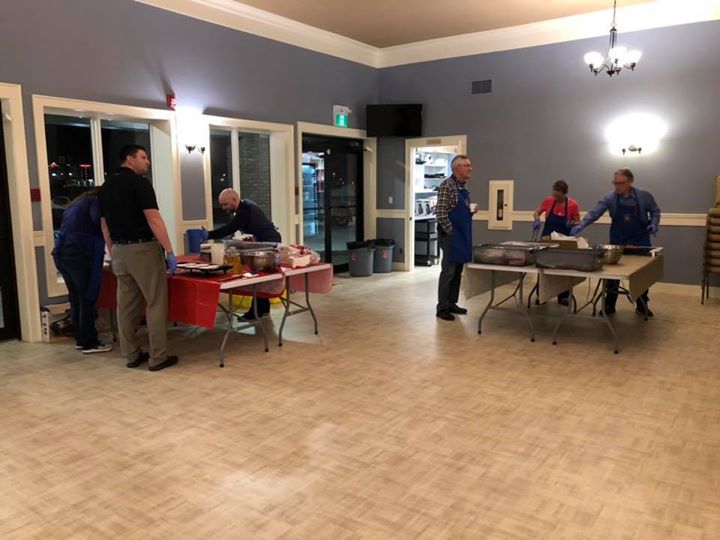 BBQ team serving up breakfast for Volunteer Services Bureau this morning!